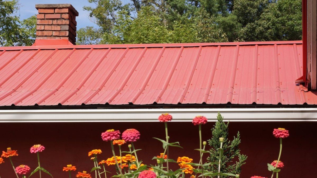A red, metal roof for a modern farmhouse. Roof U.S. offers metal roofing to mid-Missouri